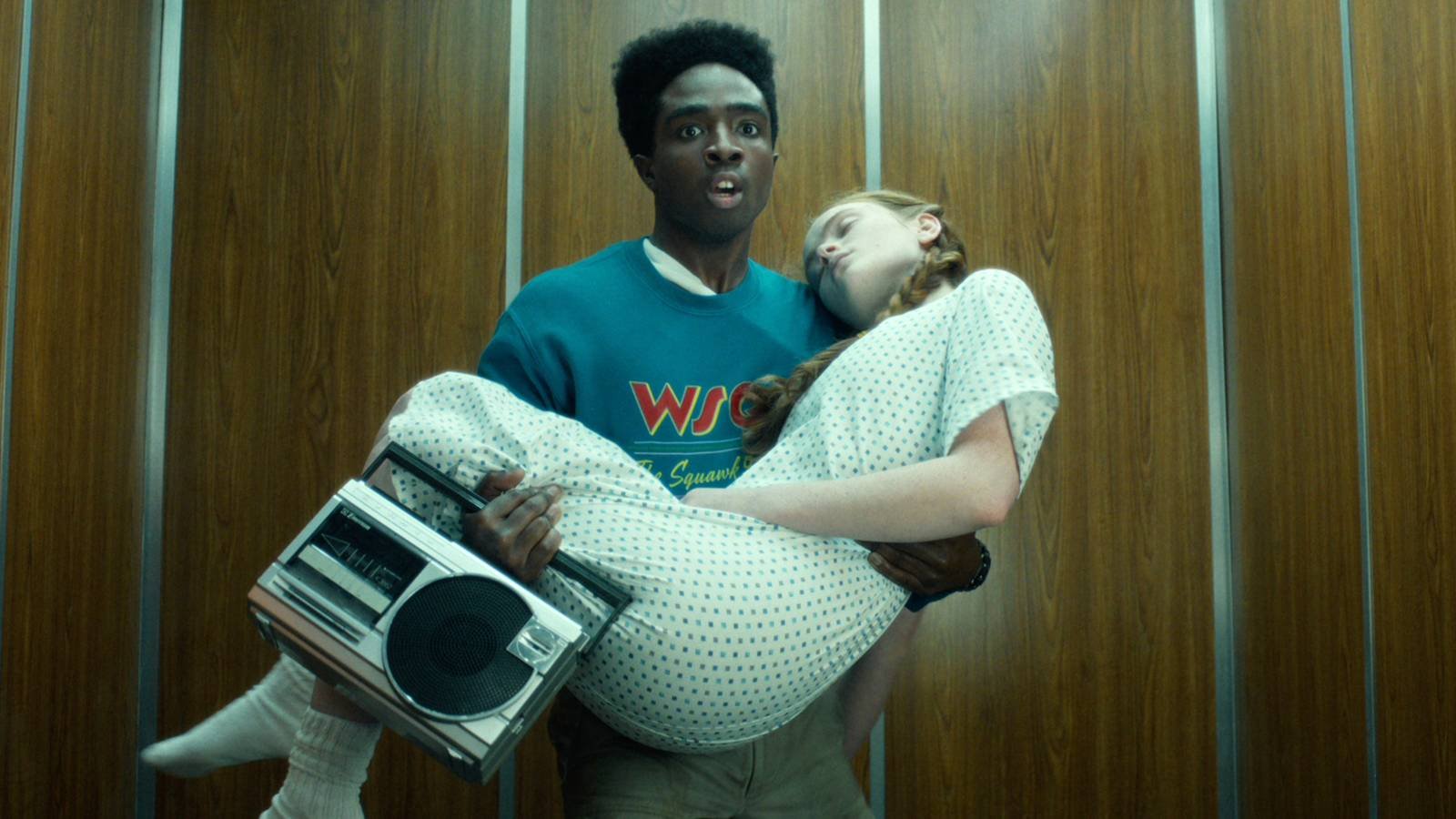 Lucas scared carrying an unconscious Max in an elevator in Stranger Things season 5