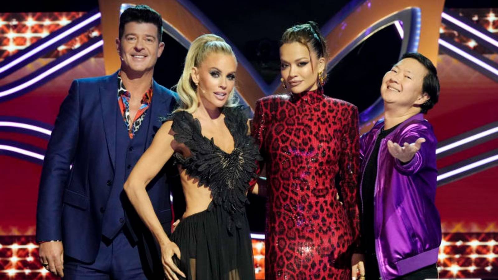 The Masked Singer Panelists Robin Thicke, Jenny McCarthy-Wahlberg, Rita Ora, and Ken Jeong Posing...