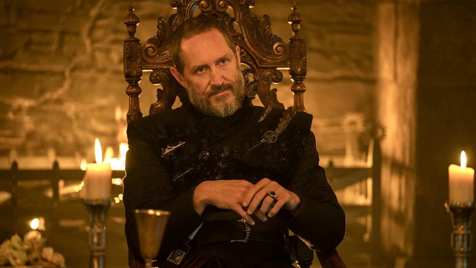 Bertie Carvel sitting in a chair in A Knight of the Seven Kingdoms