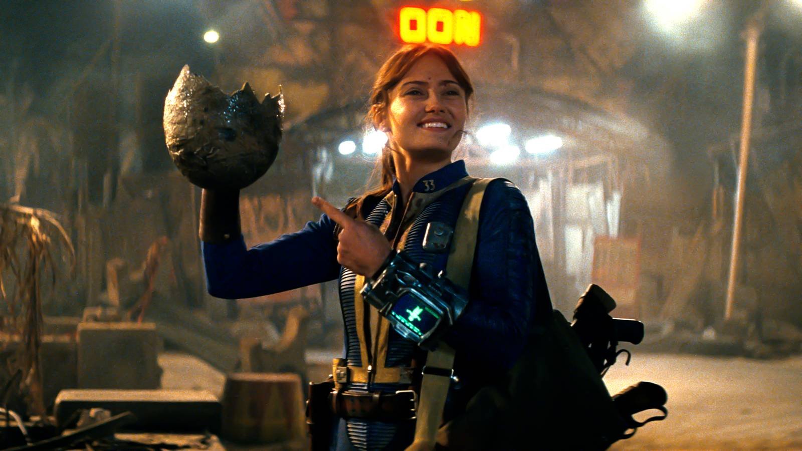 Ella Purnell's Lucy holding a Deathclaw egg in Fallout season 2