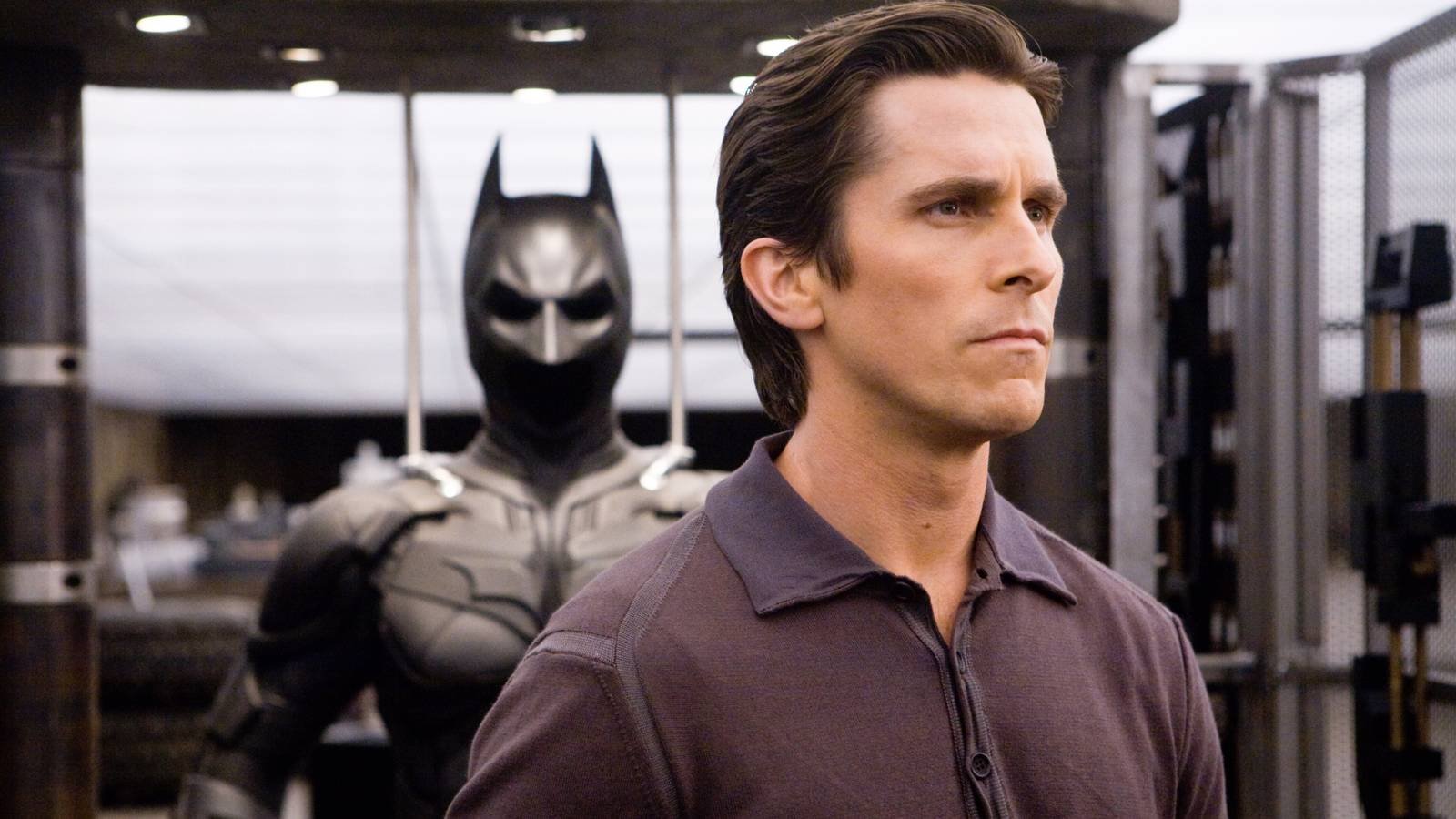 Christian Bale in front of the Bat-Suit in The Dark Knight