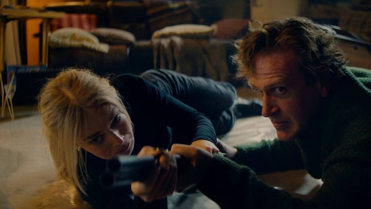 Jason Segel and Samara Weaving struggle over a gun in Over Your Dead Body