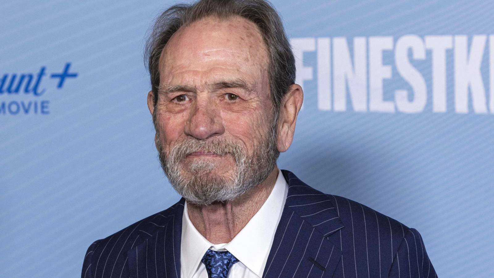 Tommy Lee Jones attending a red carpet premiere for a show
