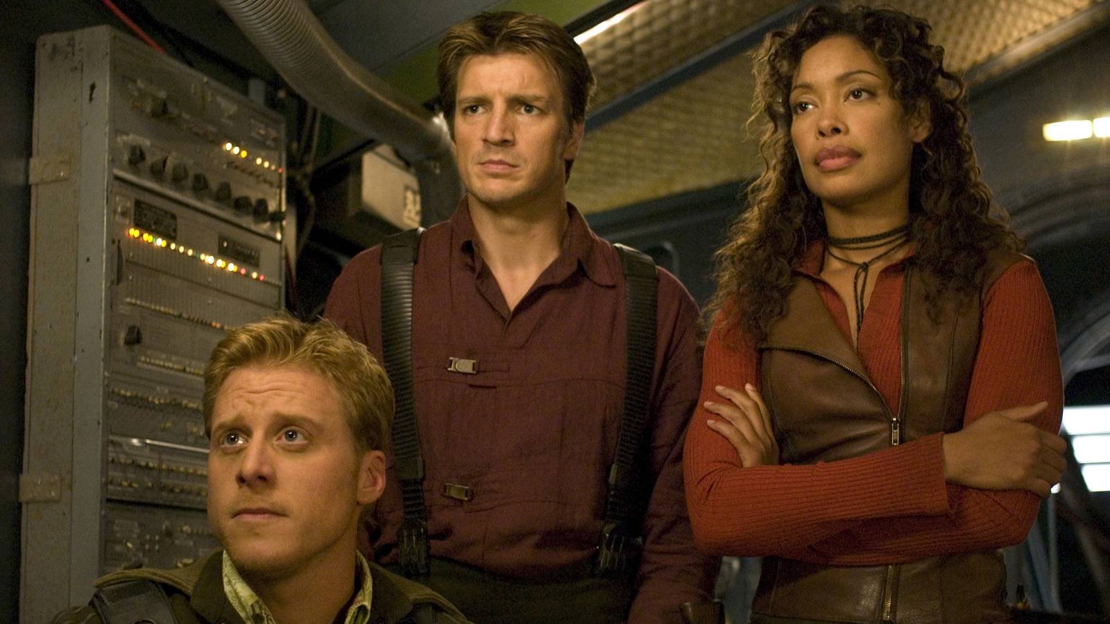 Wash, Mal, and Zoe looking off-screen in Serenity