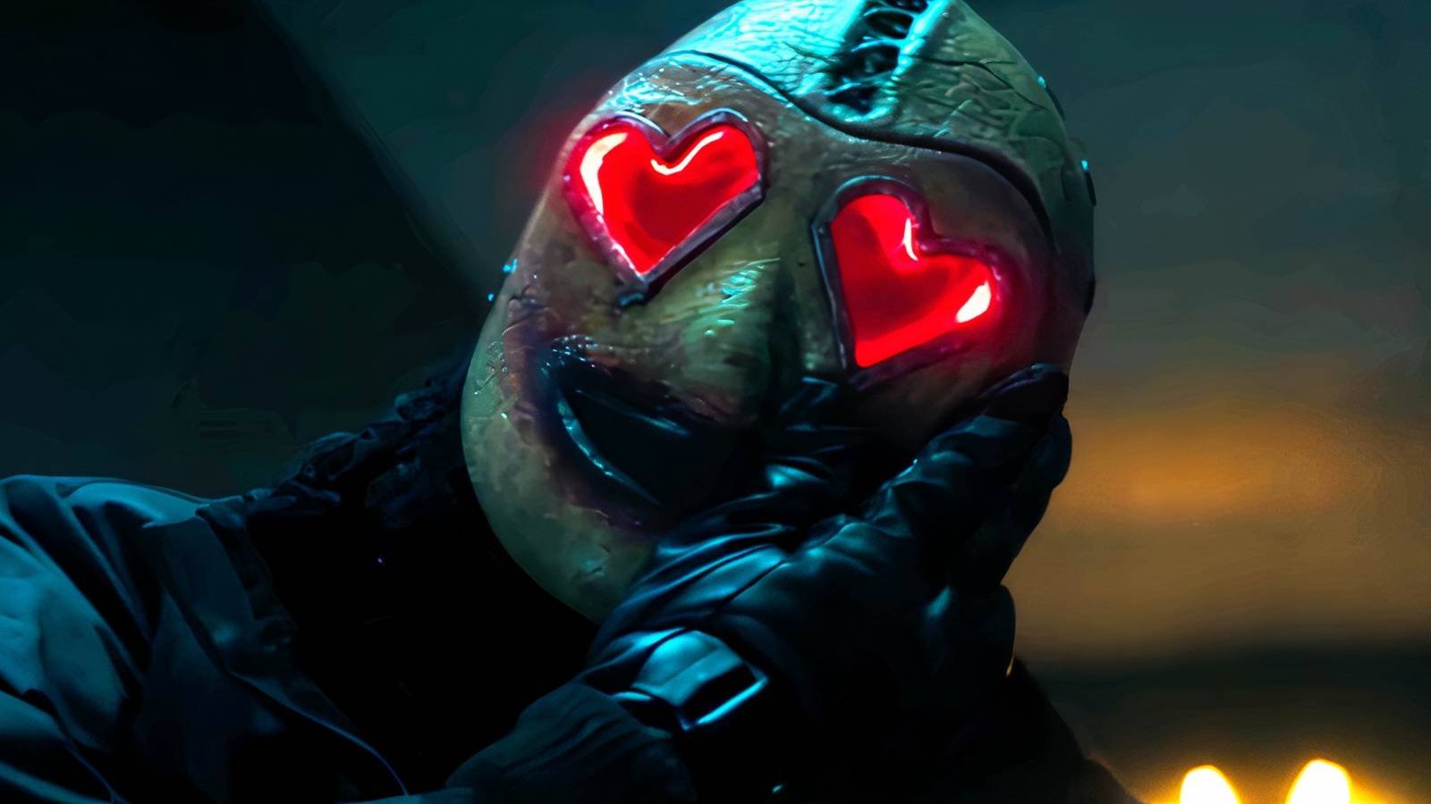 Heart Eyes Killer rubbing blood on his mask in Heart Eyes