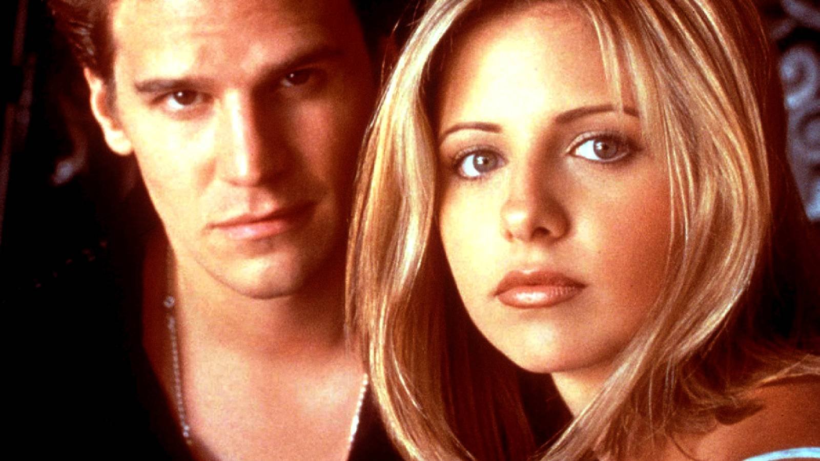 Sarah Michelle Gellar's Buffy the Vampire Slayer and David Boreanaz's Angel look at the camera to...