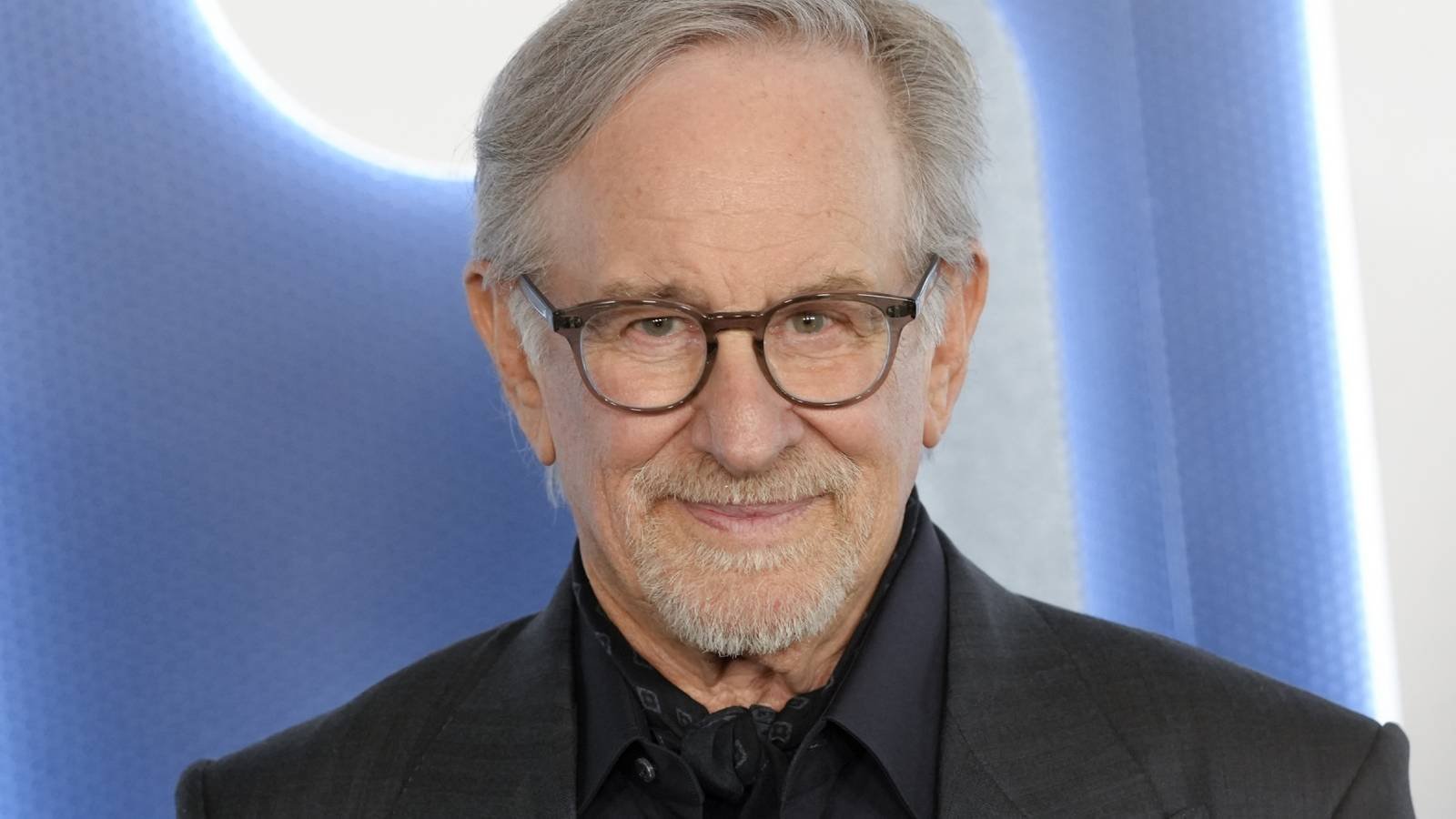 Steven Spielberg posing on a red carpet for Disclosure Day