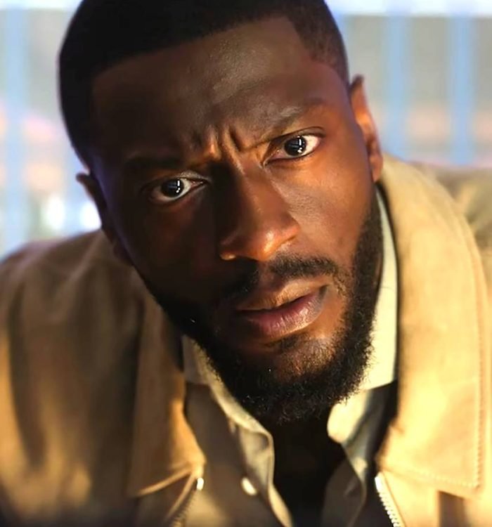 Aldis Hodge as Alex looking intensely at a computer screen in Cross season 2