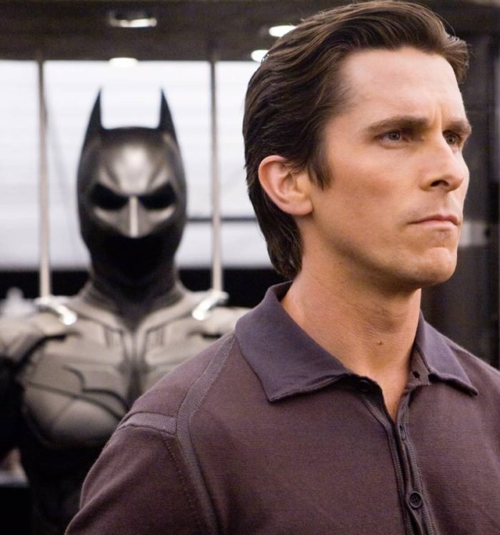 Christian Bale in front of the Bat-Suit in The Dark Knight