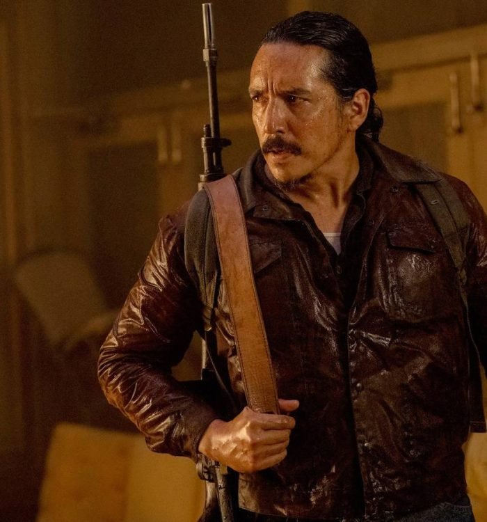 Gabriel Luna as Tommy holding a rifle on his back in HBO's The Last of Us