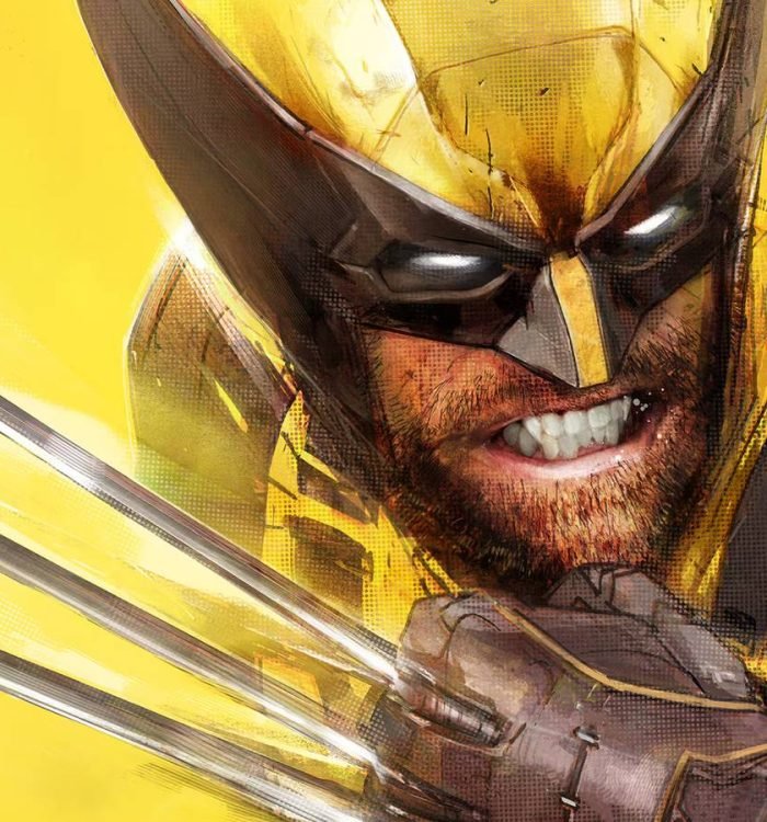 Marvel's Wolverine cover art closeup showing Logan in his iconic yellow costume, grimacing with h...