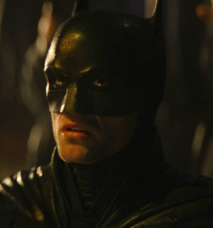 Robert Pattinson's Batman looking scared upwards in The Batman