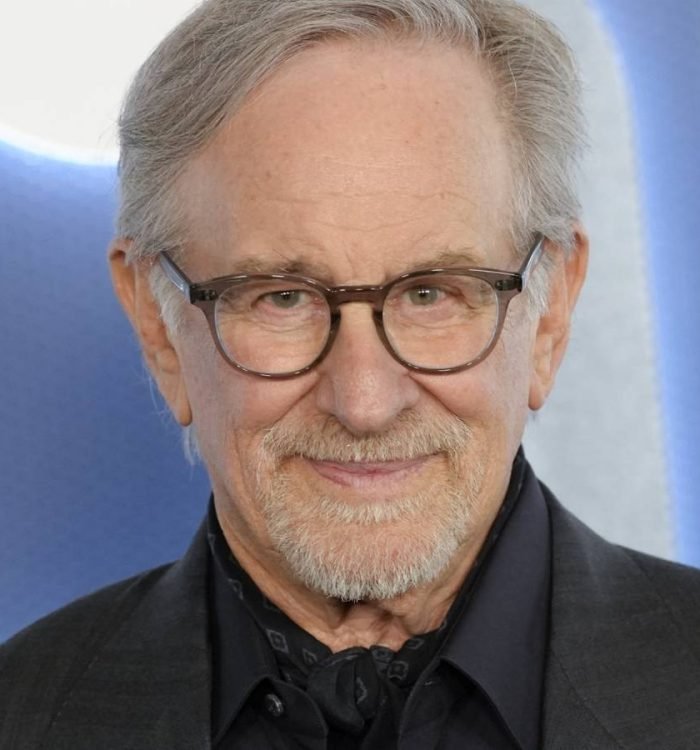 Steven Spielberg posing on a red carpet for Disclosure Day