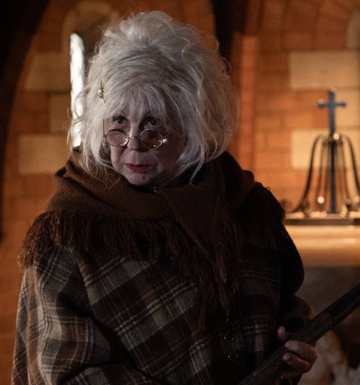 Vicki Lawrence as Lotte holding a shovel in Palm Royale season 2