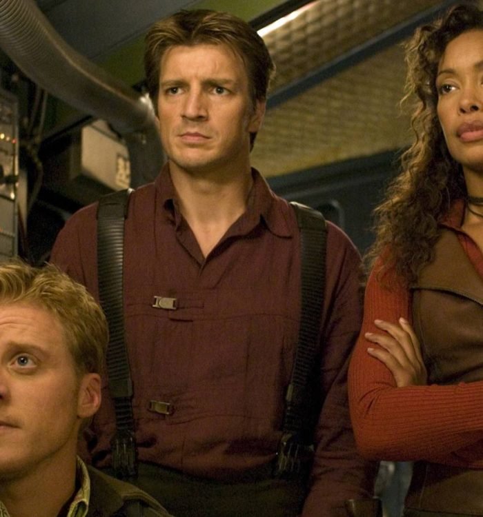 Wash, Mal, and Zoe looking off-screen in Serenity