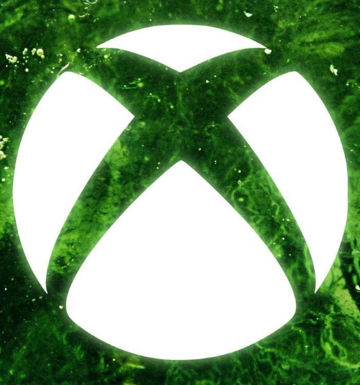 The white Xbox logo is superimposed over green ooze.